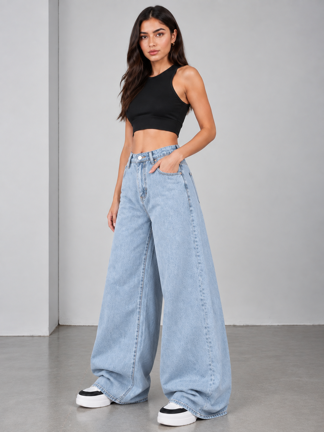The Drip - Mid Wash Wide-Leg Jeans; three-quarter view on model
