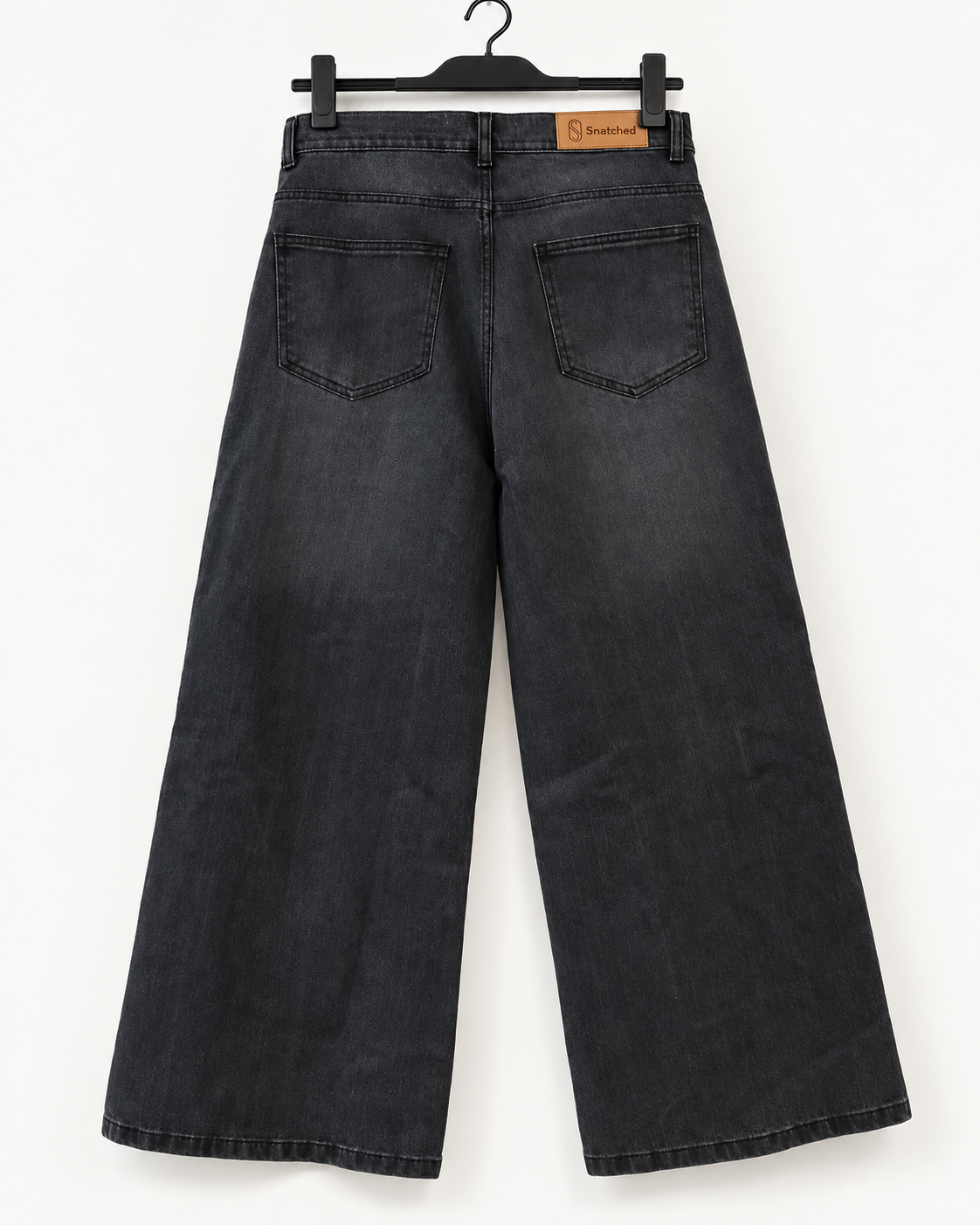 The Eclipse faded-black super wide-leg jeans, full back view with Snatched patch