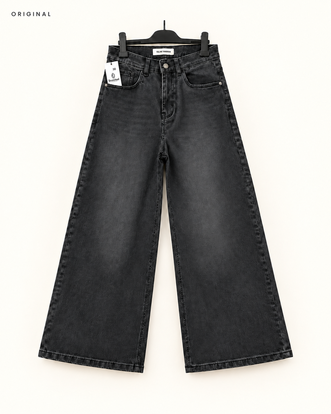 The Eclipse faded-black super wide-leg stretch jeans, front view on hanger