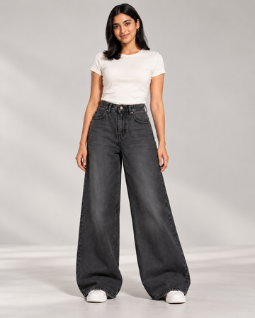 The Eclipse faded-black super wide-leg jeans, studio model view